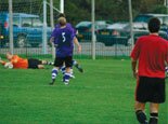 Tom Hopper watches the opposition keeper save another attempt on goal.