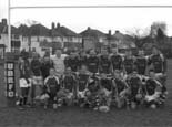 The Rugby League boys strike a team pose under the posts