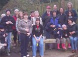 Friends and relatives of Ben Lockwood gather at his bench in Cheltenham