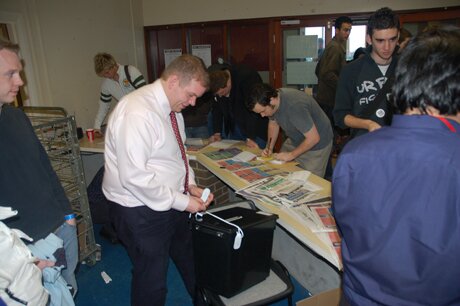 Stuart Rice sealing a full ballot box
