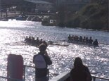 The two boats head towards the finish line.